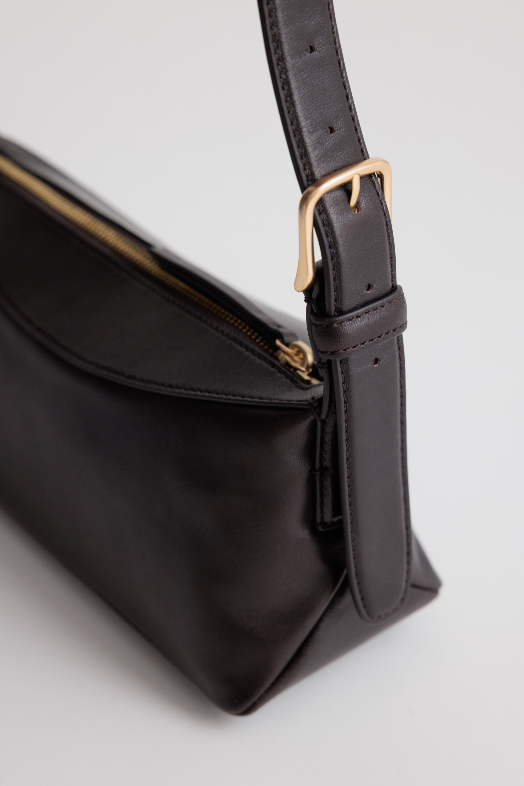 Bobby Bag in Americano Lambskin detail view showing adjustable shoulder strap and custom chrome buckle