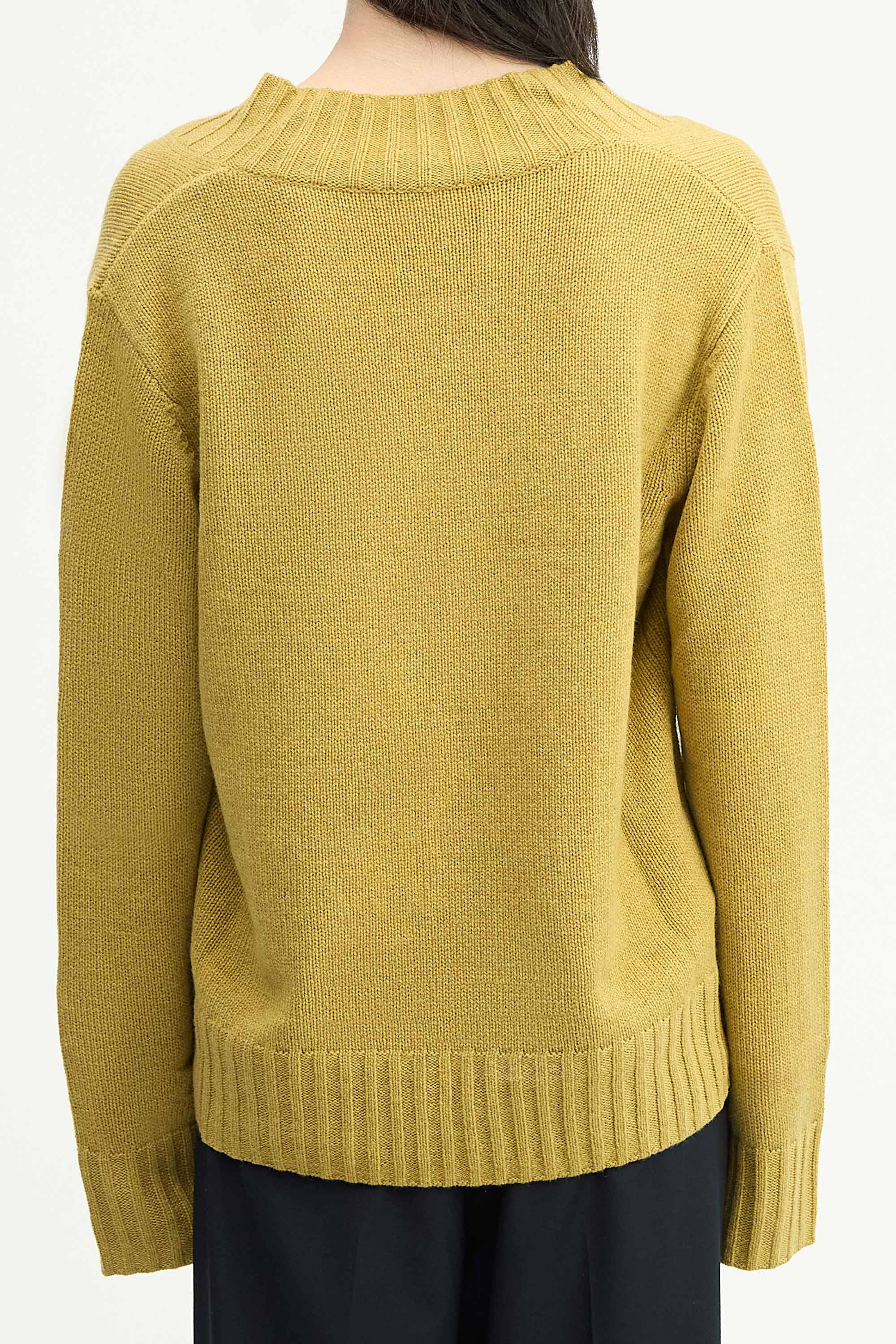 Model wearing the Cashmere V-Neck Knit in Chartreuse back view
