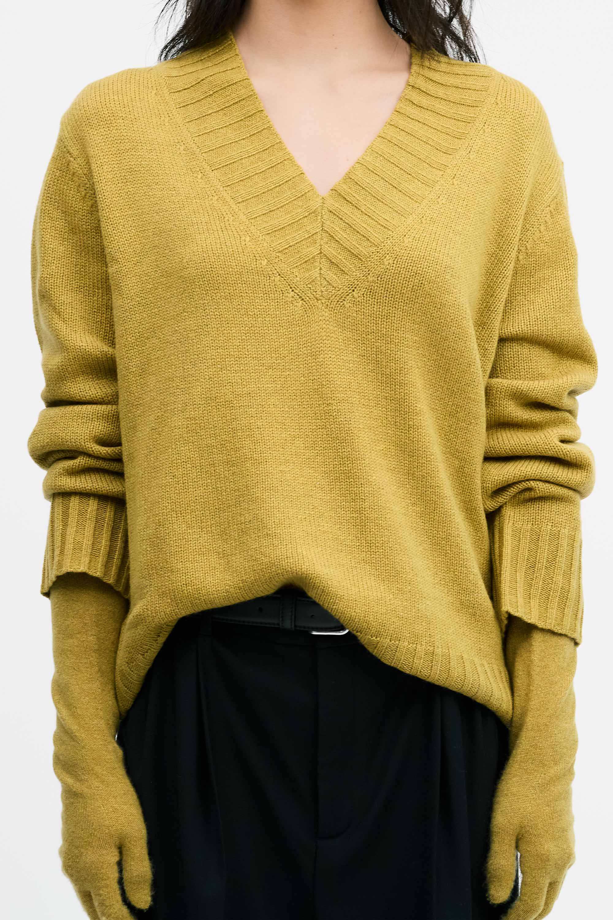 Model wearing the Cashmere V-Neck Knit in Chartreuse and gloves