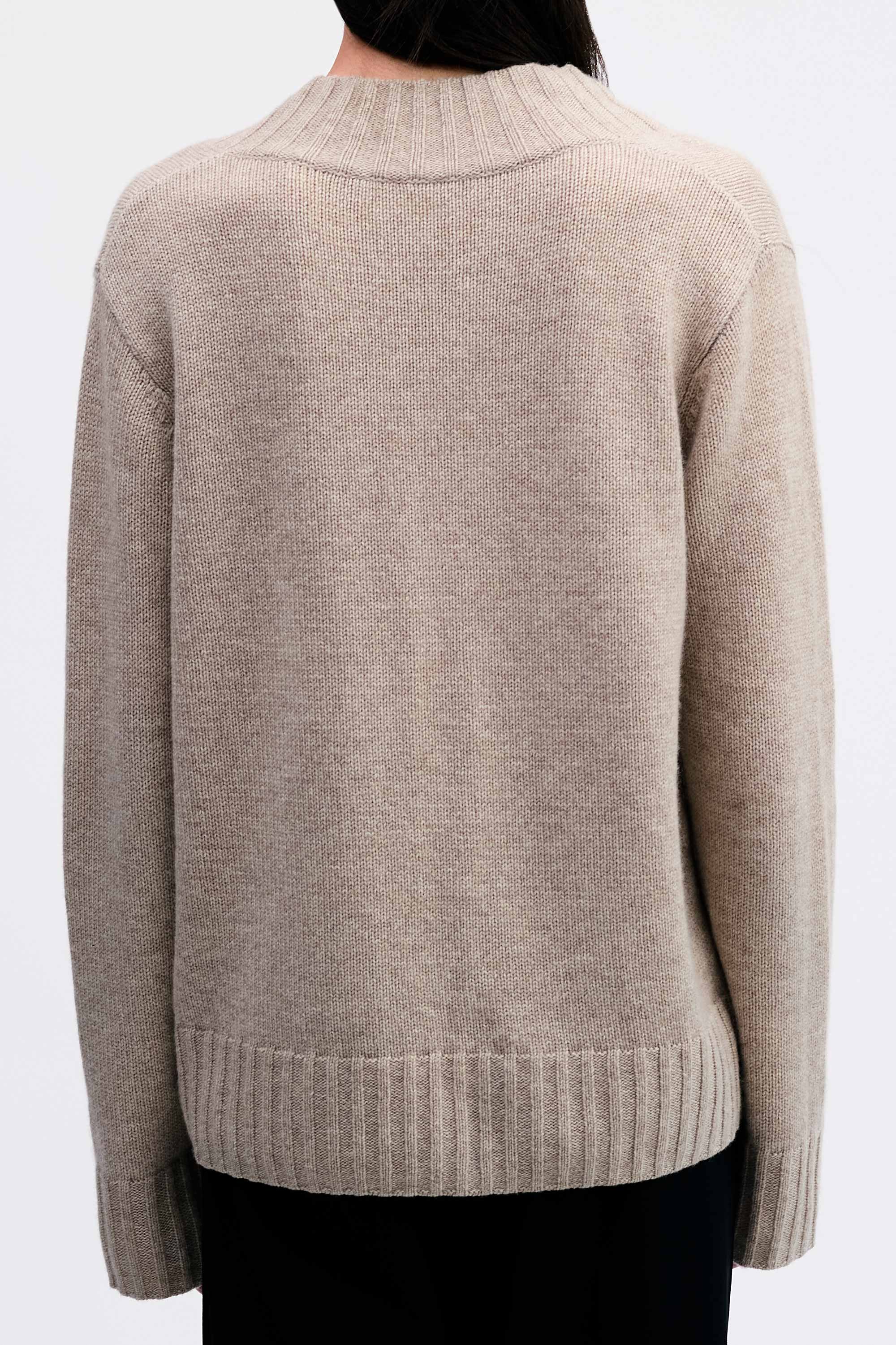 Model wearing the Cashmere V-neck Knit in Fawn back view