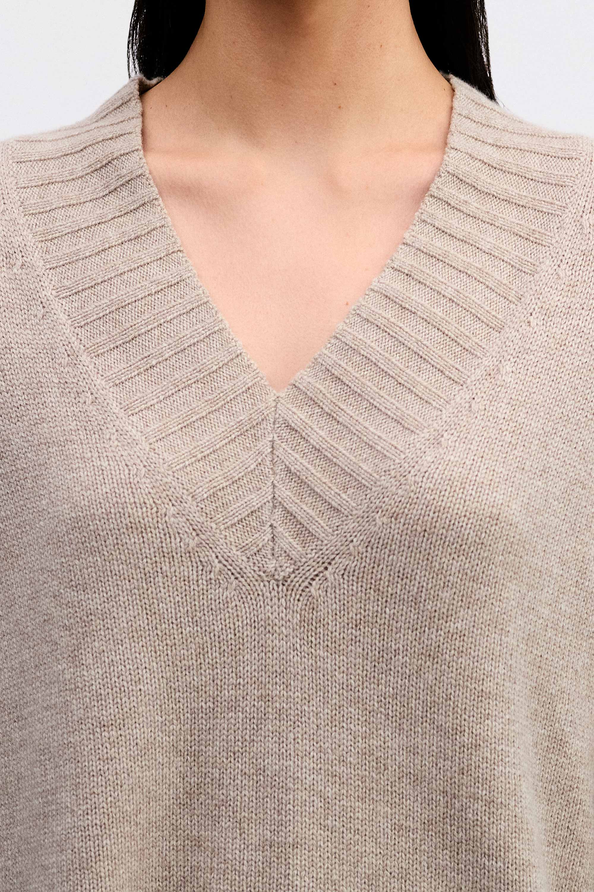 Model wearing the Cashmere V-neck Knit in Fawn detail view