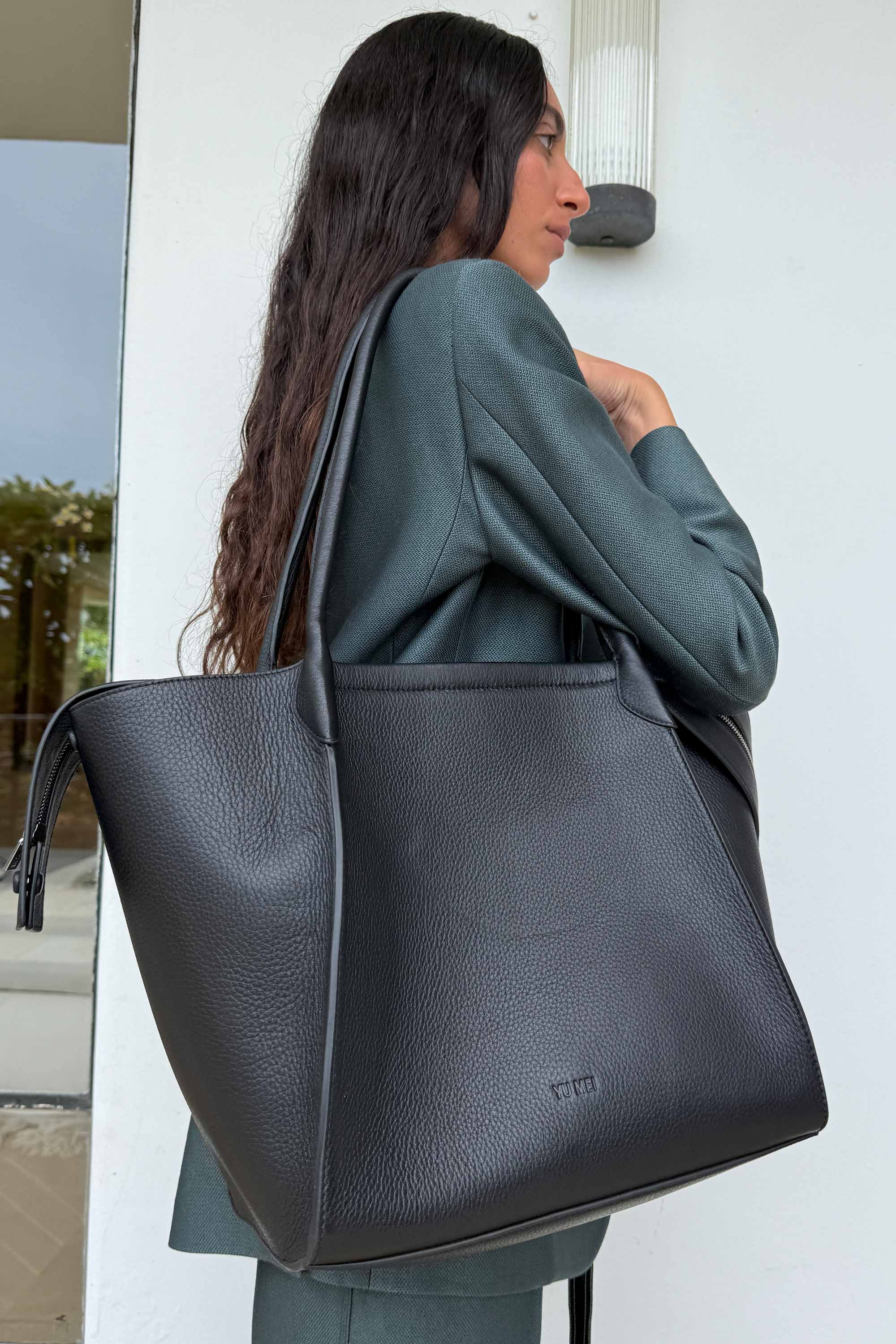 Claudia Tote in Black Deer Nappa worn on shoulders