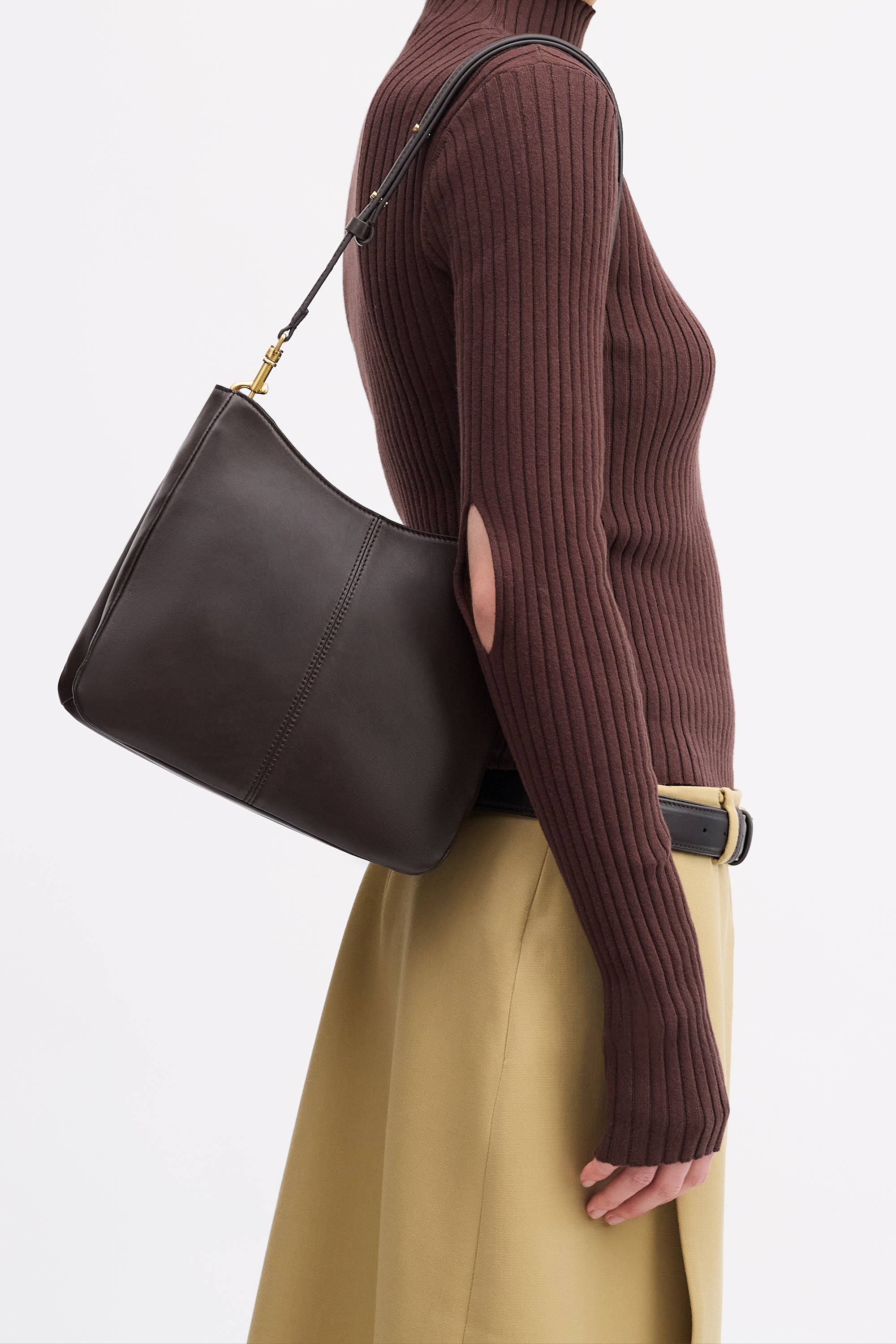 Joan Bag in Americano Lambskin worn on the shoulders on model wearing brown top and tan skirt