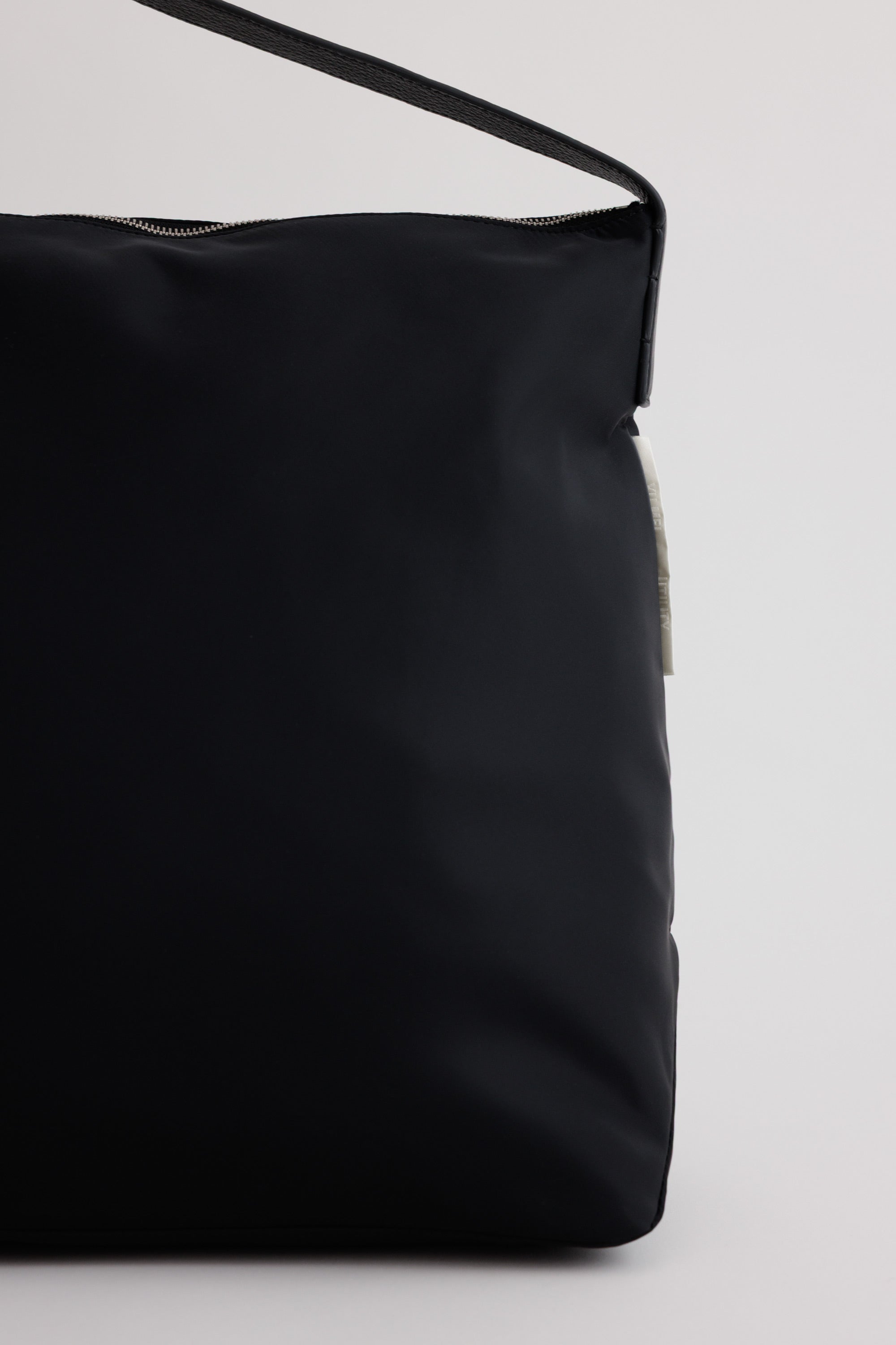 Large UTILITY Braidy in Black nylon detail view showing ECONYL regenerated nylon texture
