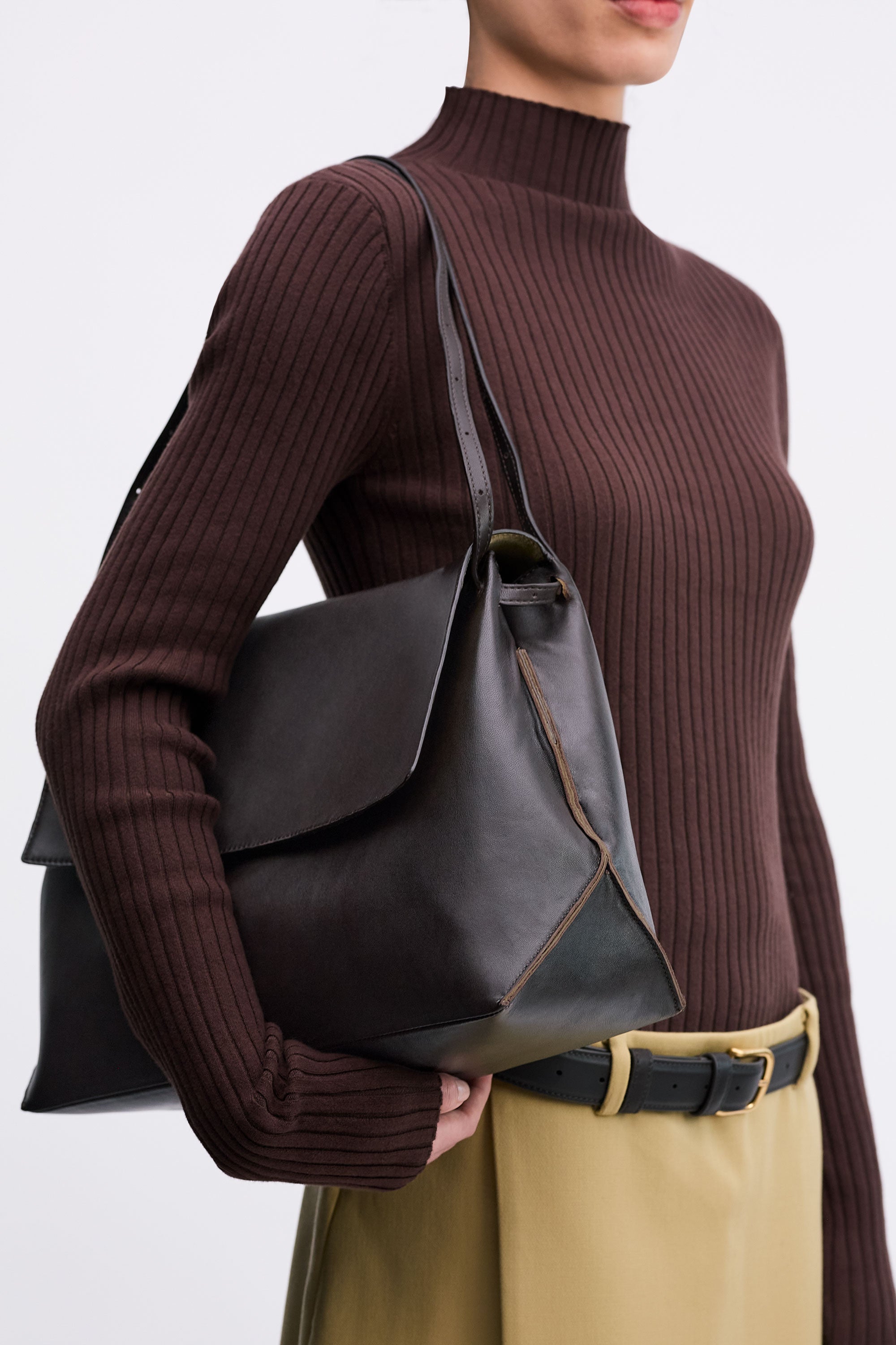 Pania Bag in Americano Lambskin worn on shoulder on model brown top and tan skirt with black belt