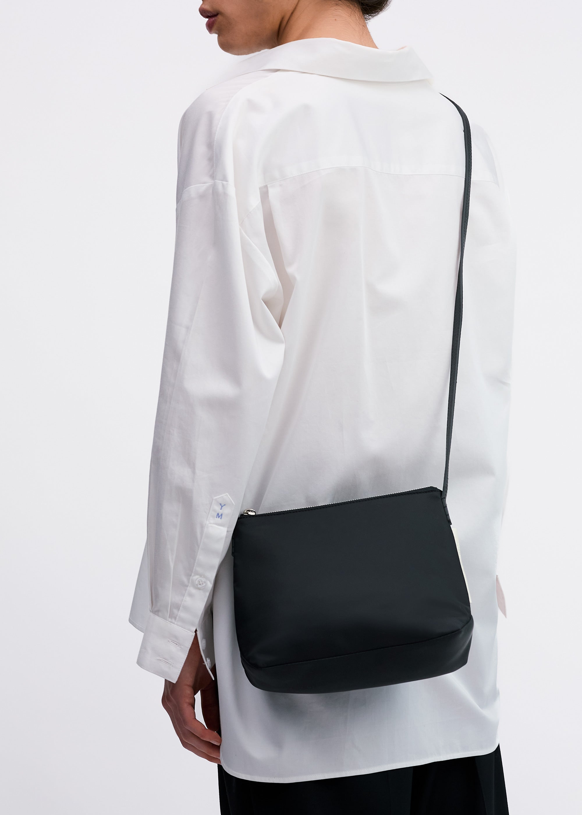Yu Mei Small UTILITY Braidy in Black Nylon worn cross-body on model in white shirt