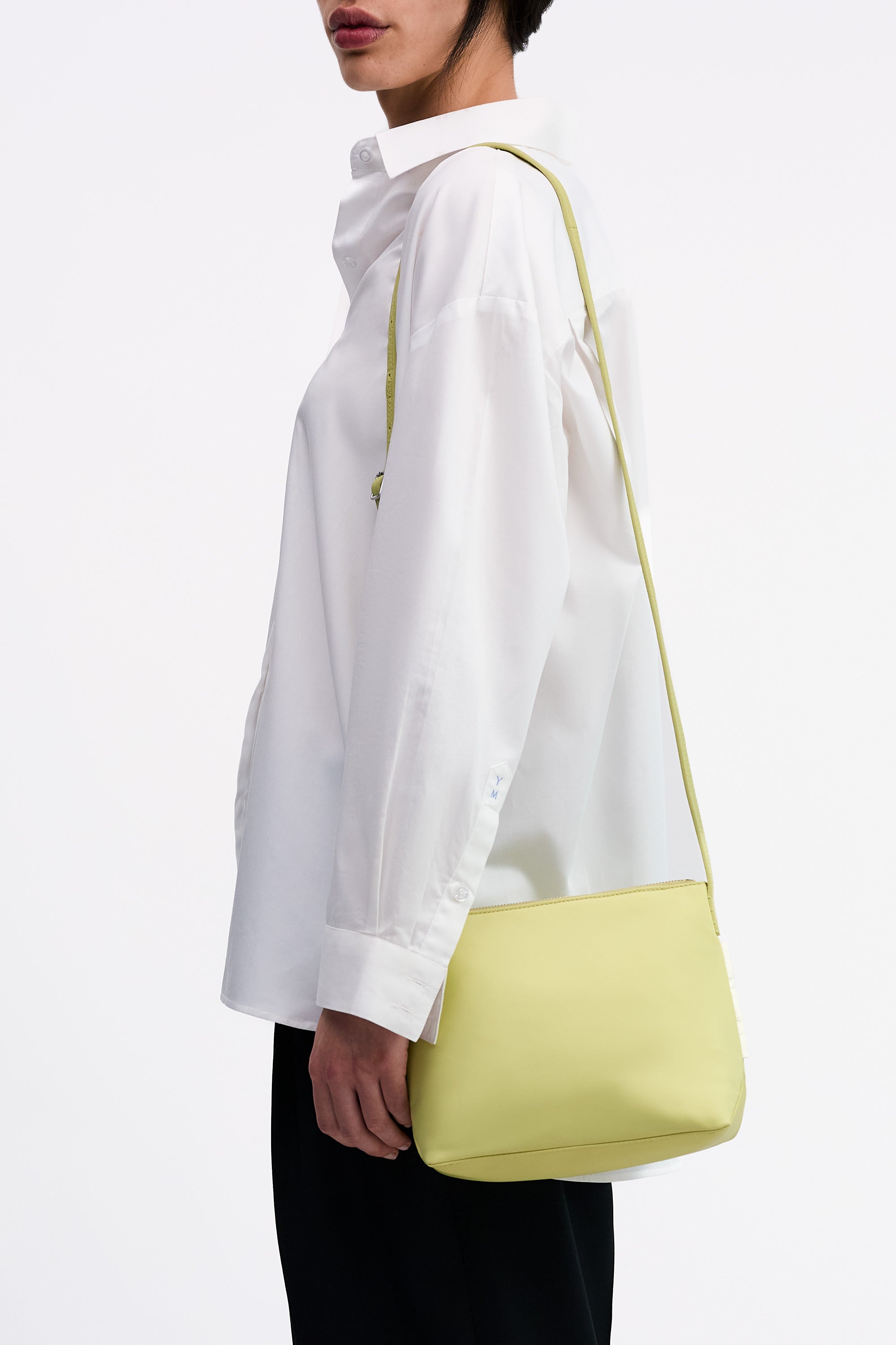Yu Mei Small UTILITY Braidy in Half Green nylon side worn on shoulder of model in white shirt and black trousers