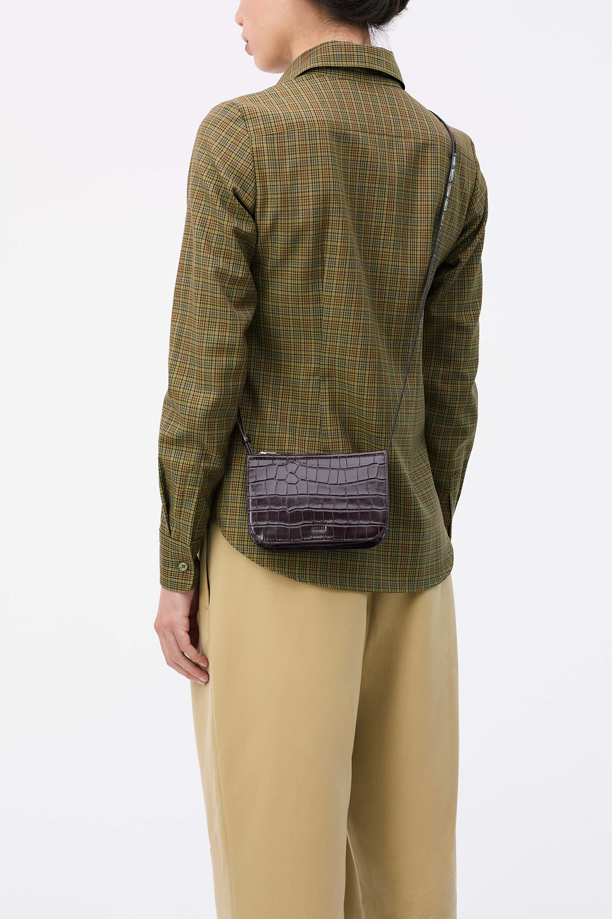 Vi Bag in Fire Croc worn cross-body on model wearing check shirt and tan pants