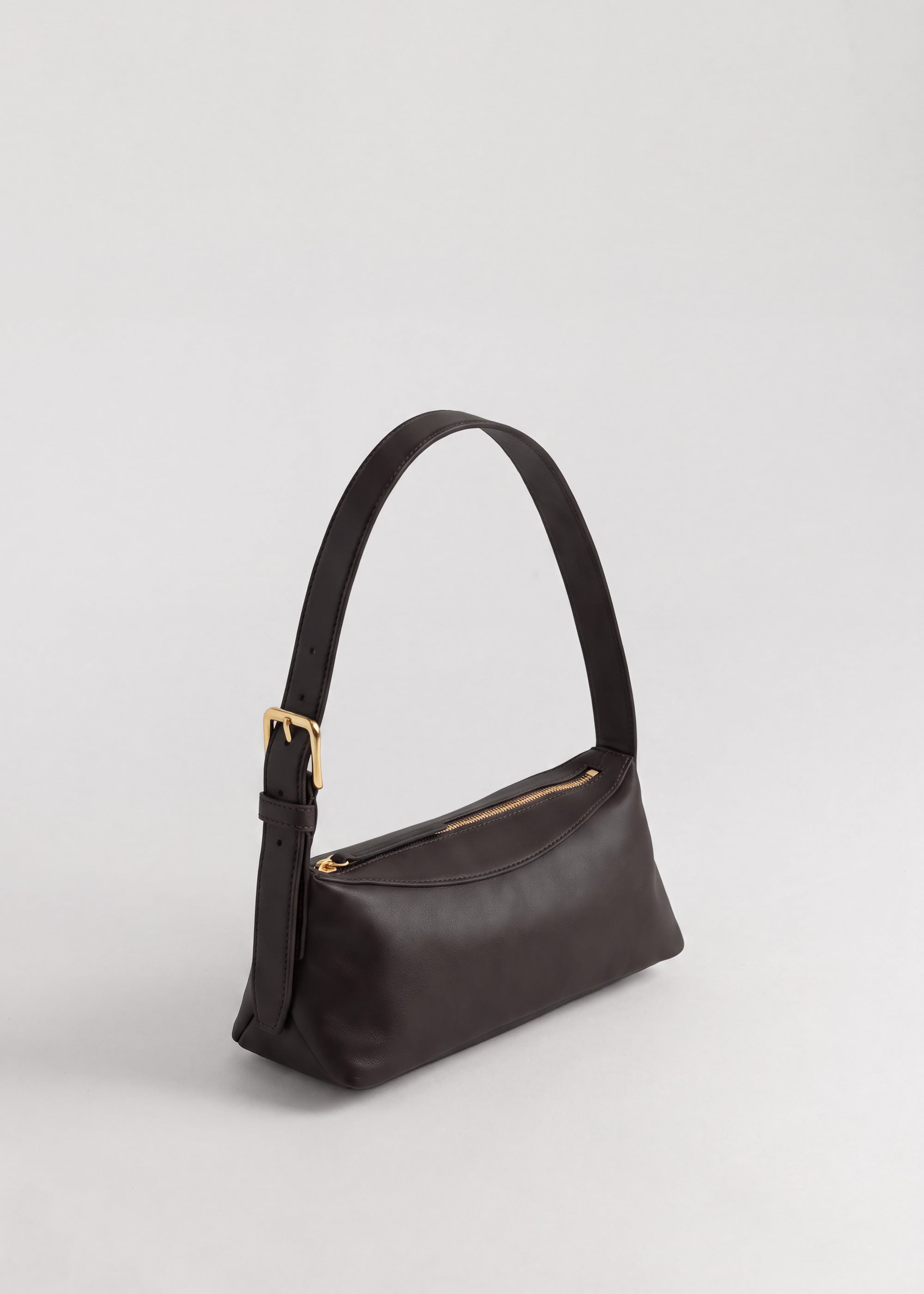 Bobby Bag in Americano Lambskin angle view showing adjustable shoulder strap and triangle panels