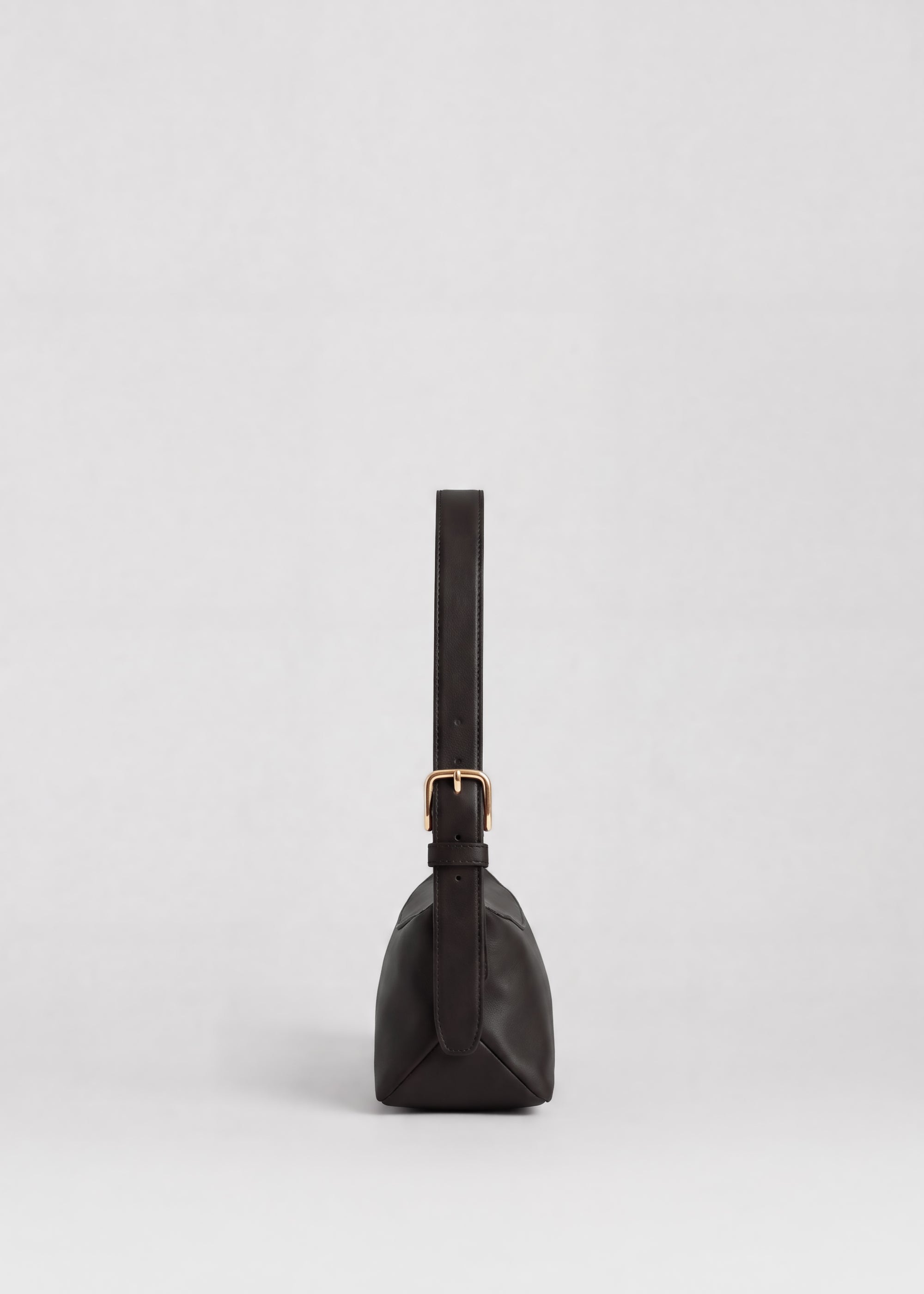 Bobby Bag in Americano Lambskin side view showing adjustable shoulder strap and signature triangle panels