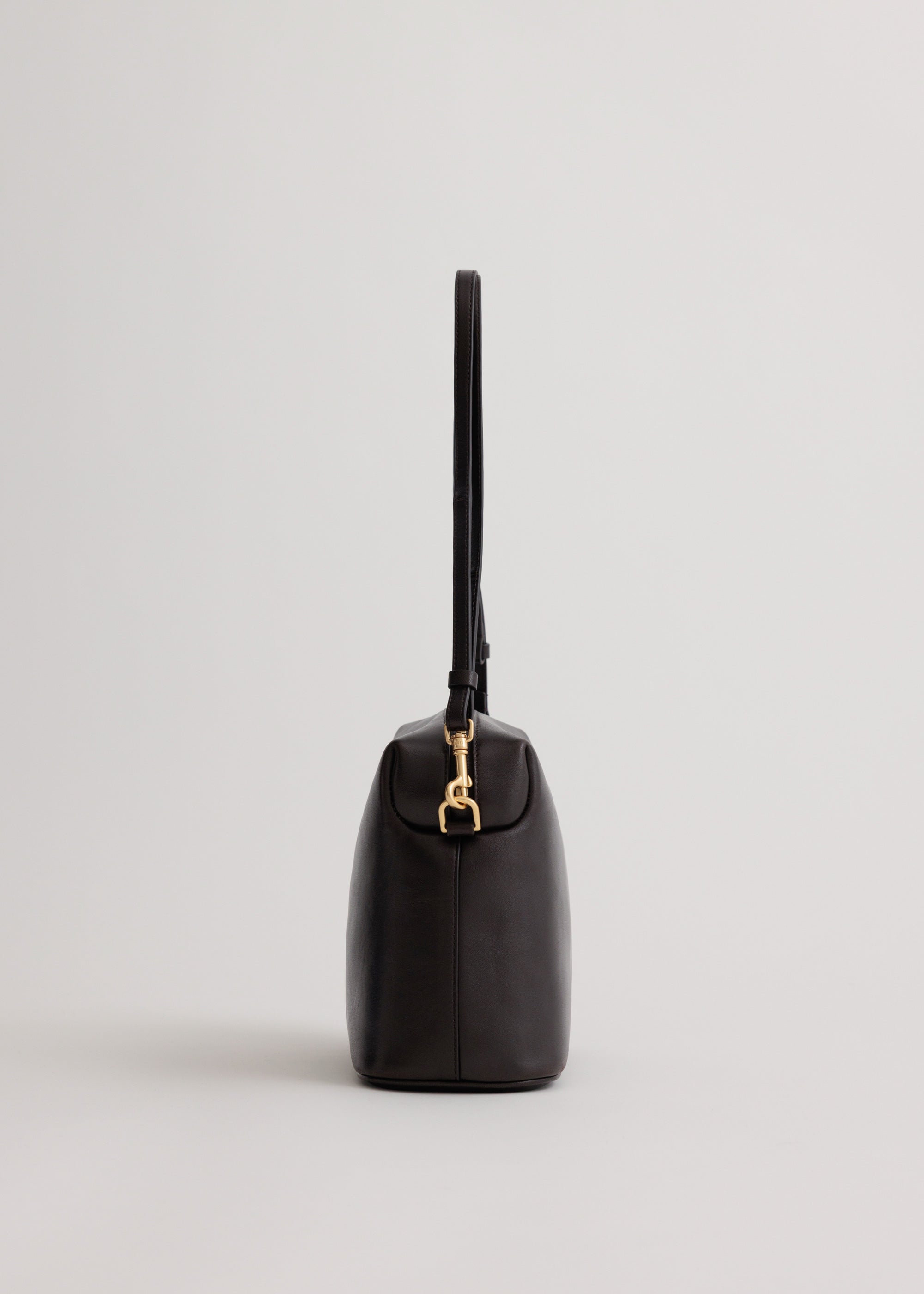 Ch'lita Bag in Americano Lambskin side view showing adjustable cross-body strap and custom hardware
