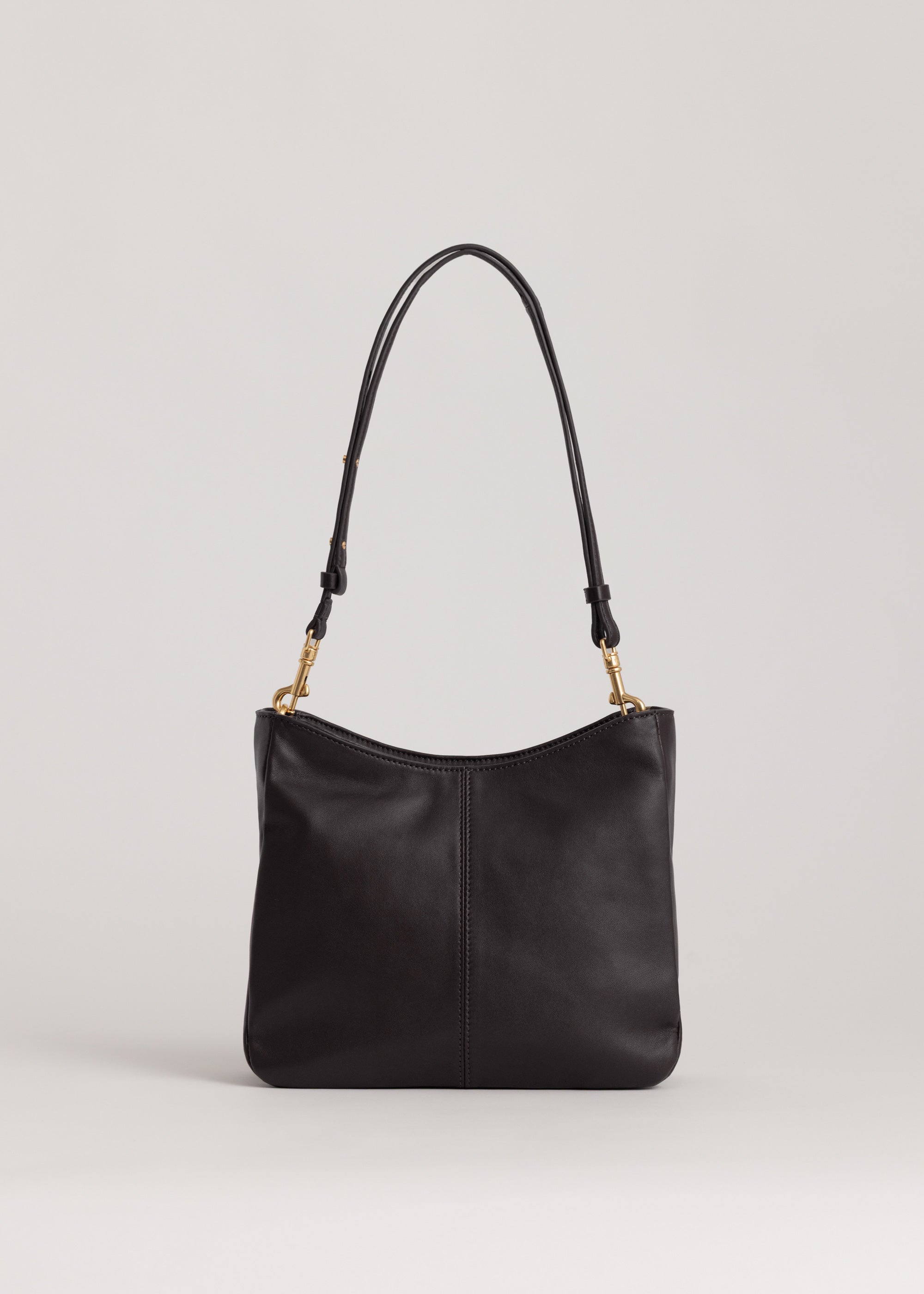 Joan Bag in Americano Lambskin back view showing crescent shaped opening and adjustable cross-body strap