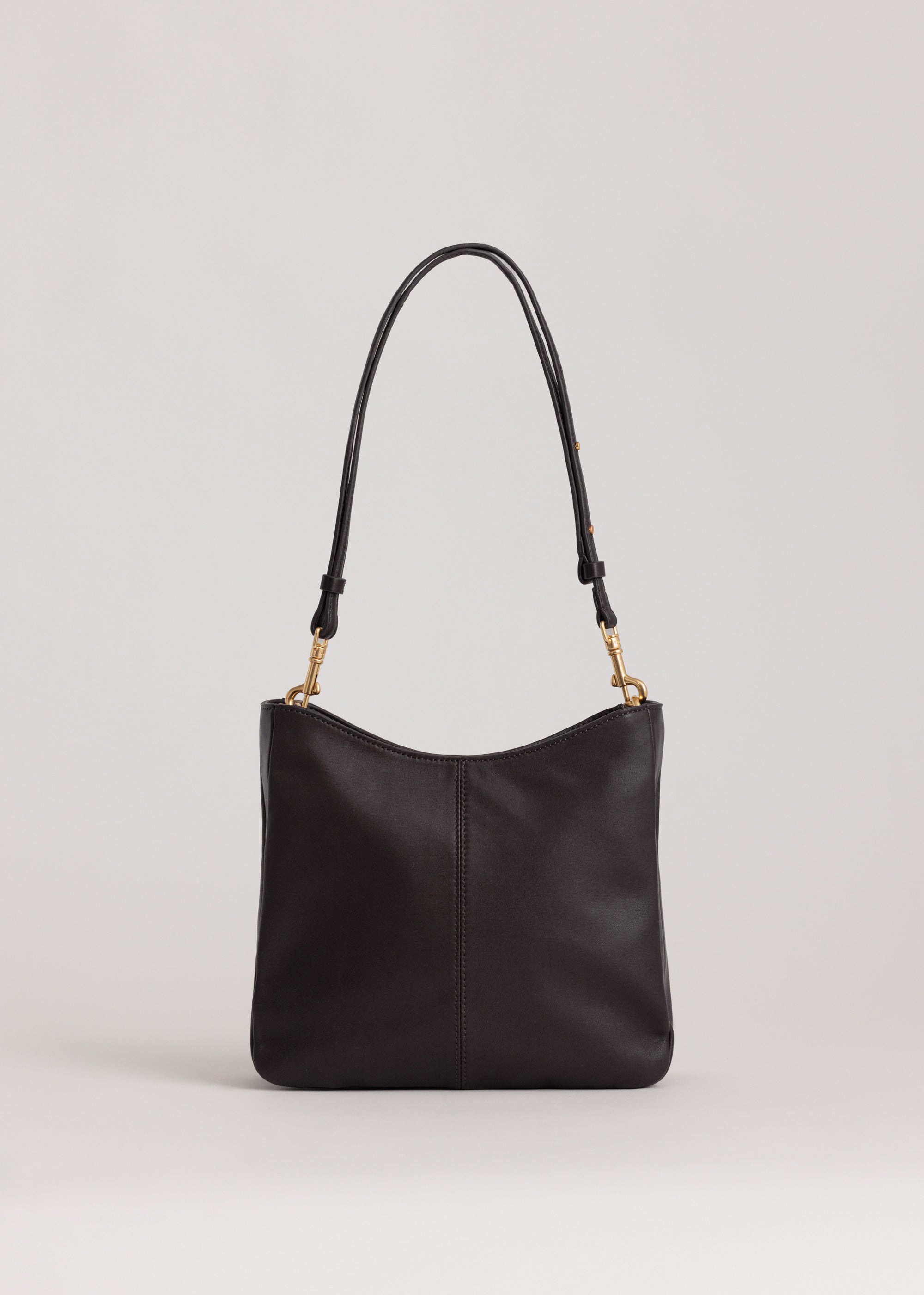 Joan Bag in Americano Lambskin front view showing crescent shaped opening and adjustable cross-body strap