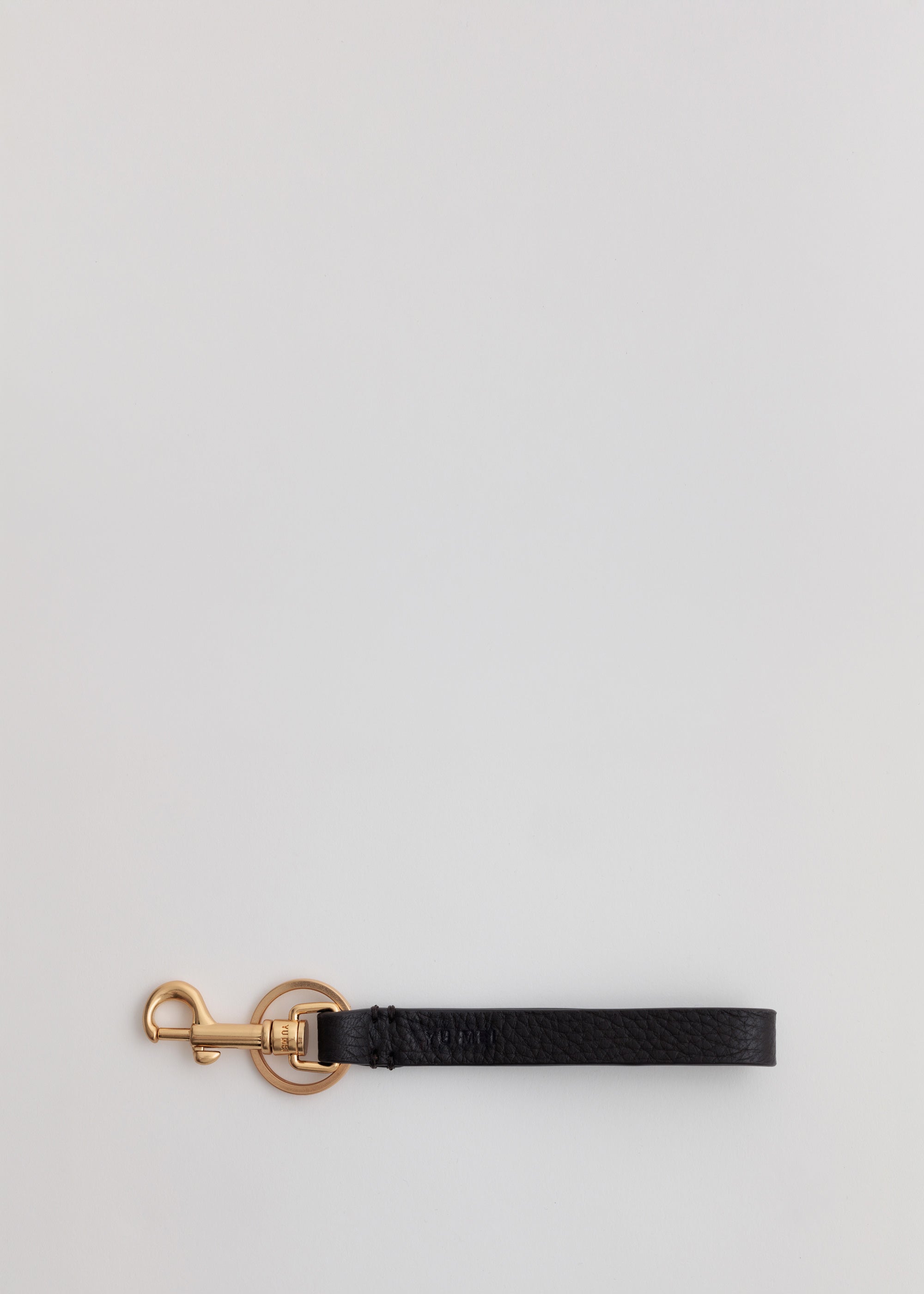Key Fob in Americano Deer Nappa front view showing solid brass key ring and debossed logo