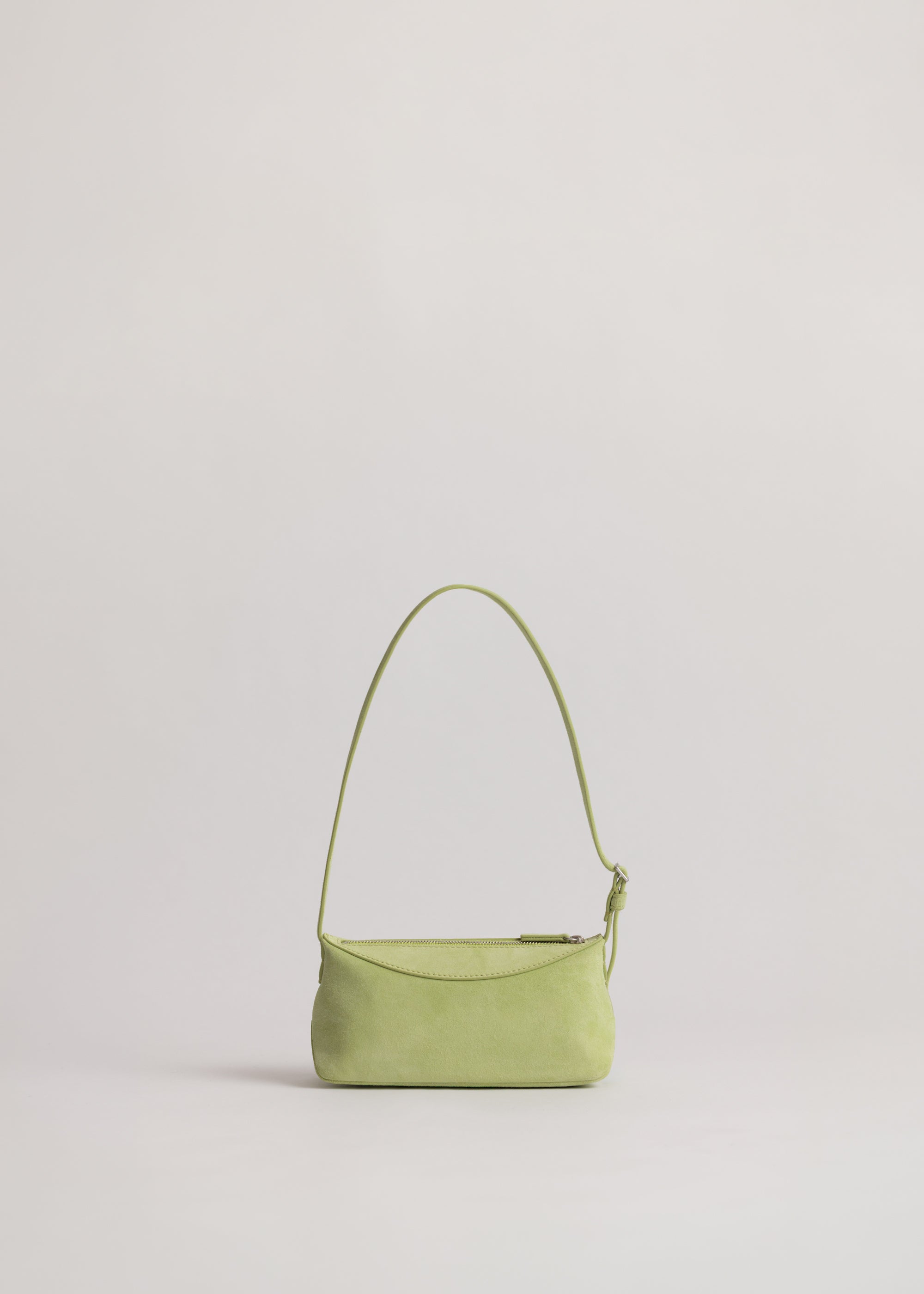 Yu Mei Mini Bobby in Apple Suede back view showing feathered belt style adjustable strap.