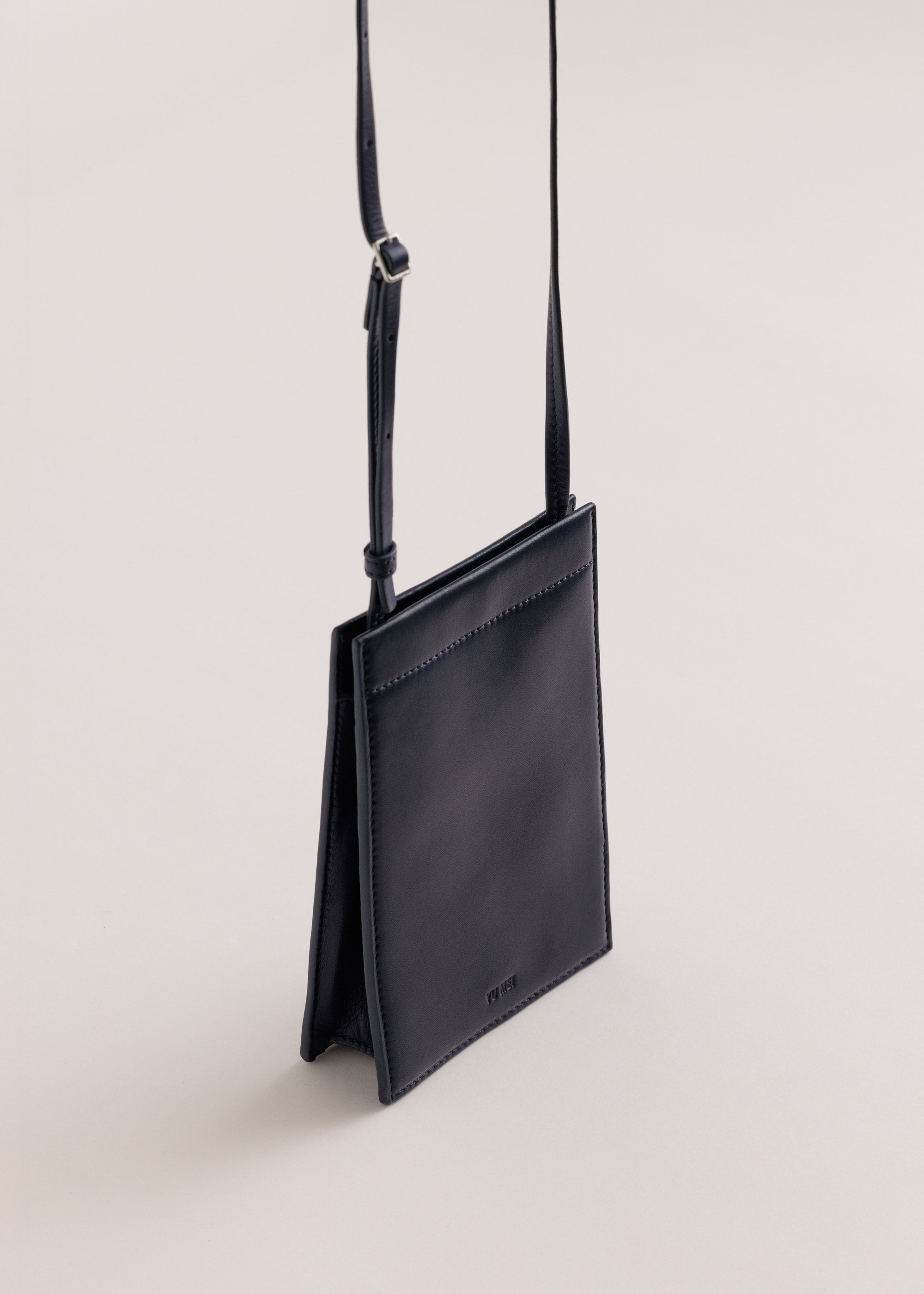 Georgie Bag in Eclipse Lambskin side view with crossbody strap up