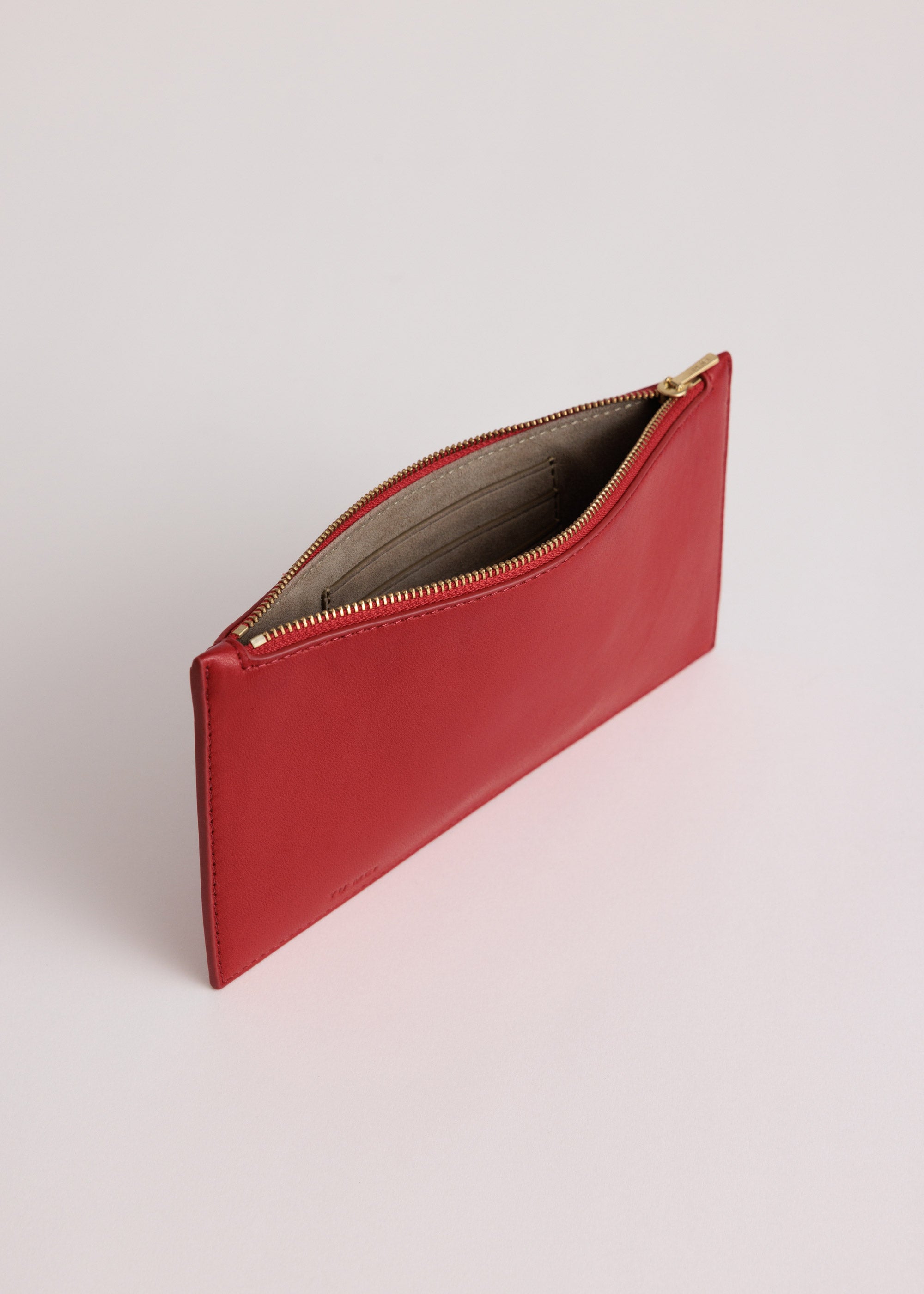 Hannah Envelope in Lobster Red Lambskin  shown unzipped with recycled suede lining