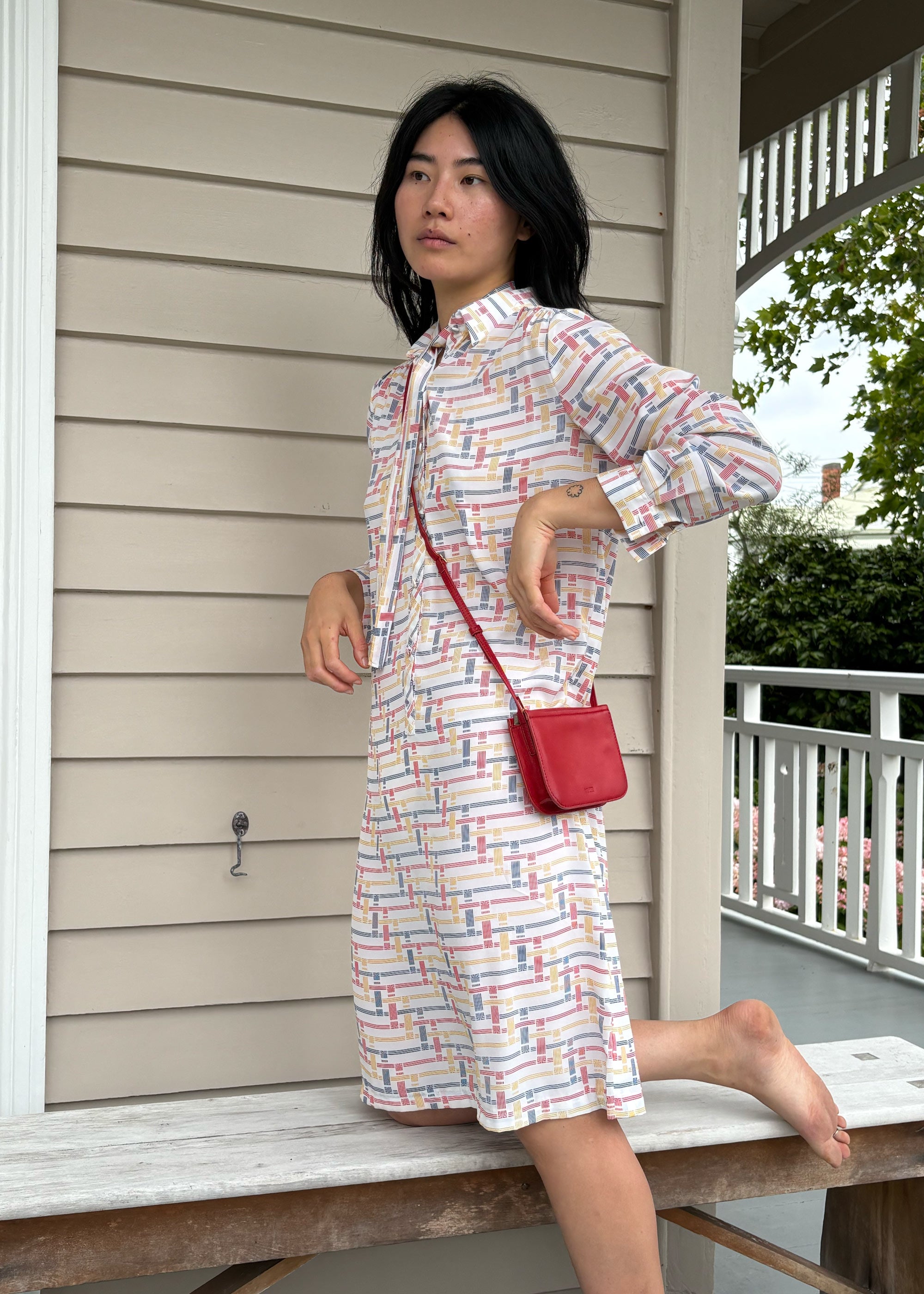 Vi Bag in Lobster Red Lambskin worn crossbody