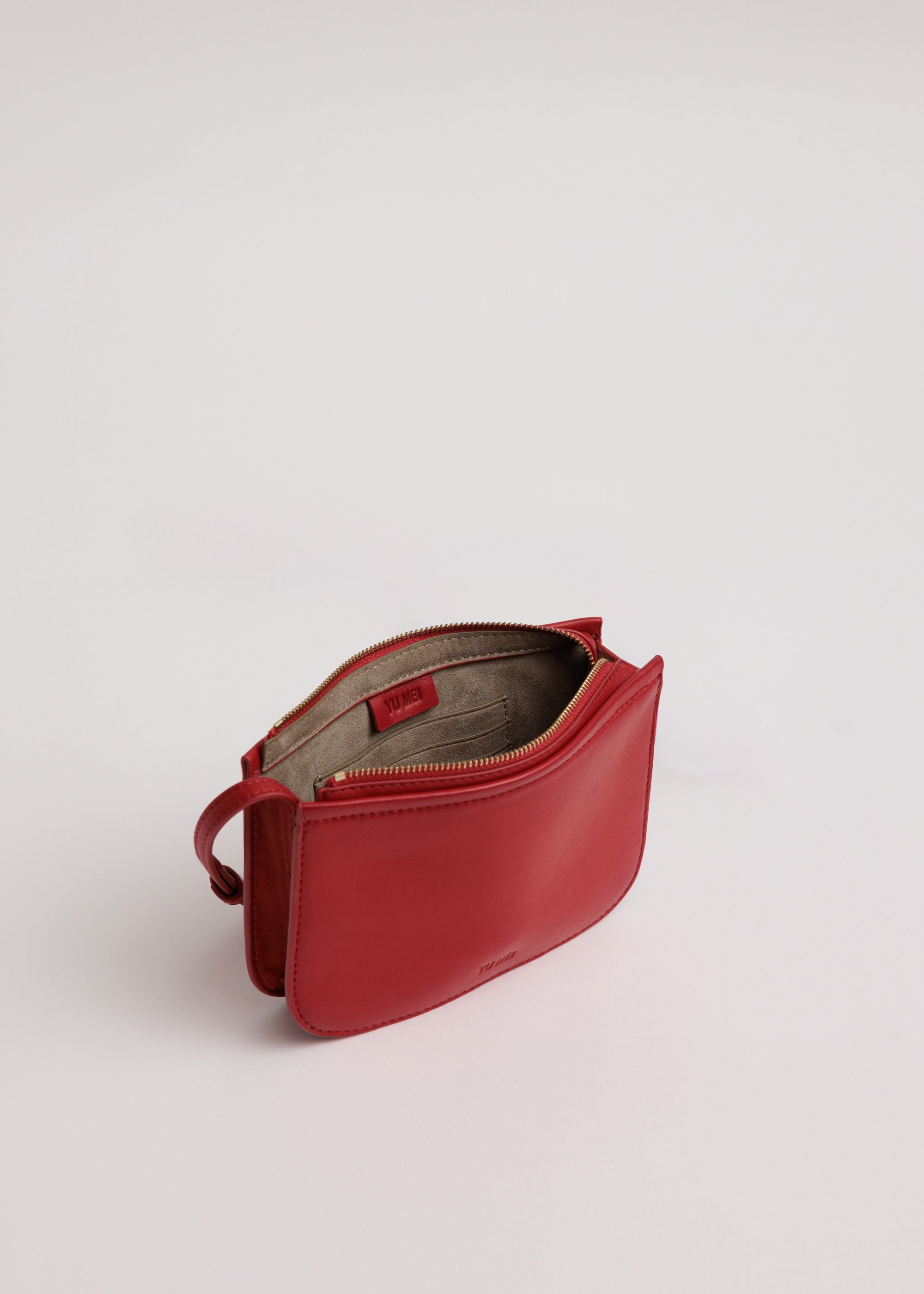 Vi Bag in Lobster Red Lambskin shown unzipped with recycled suede lining