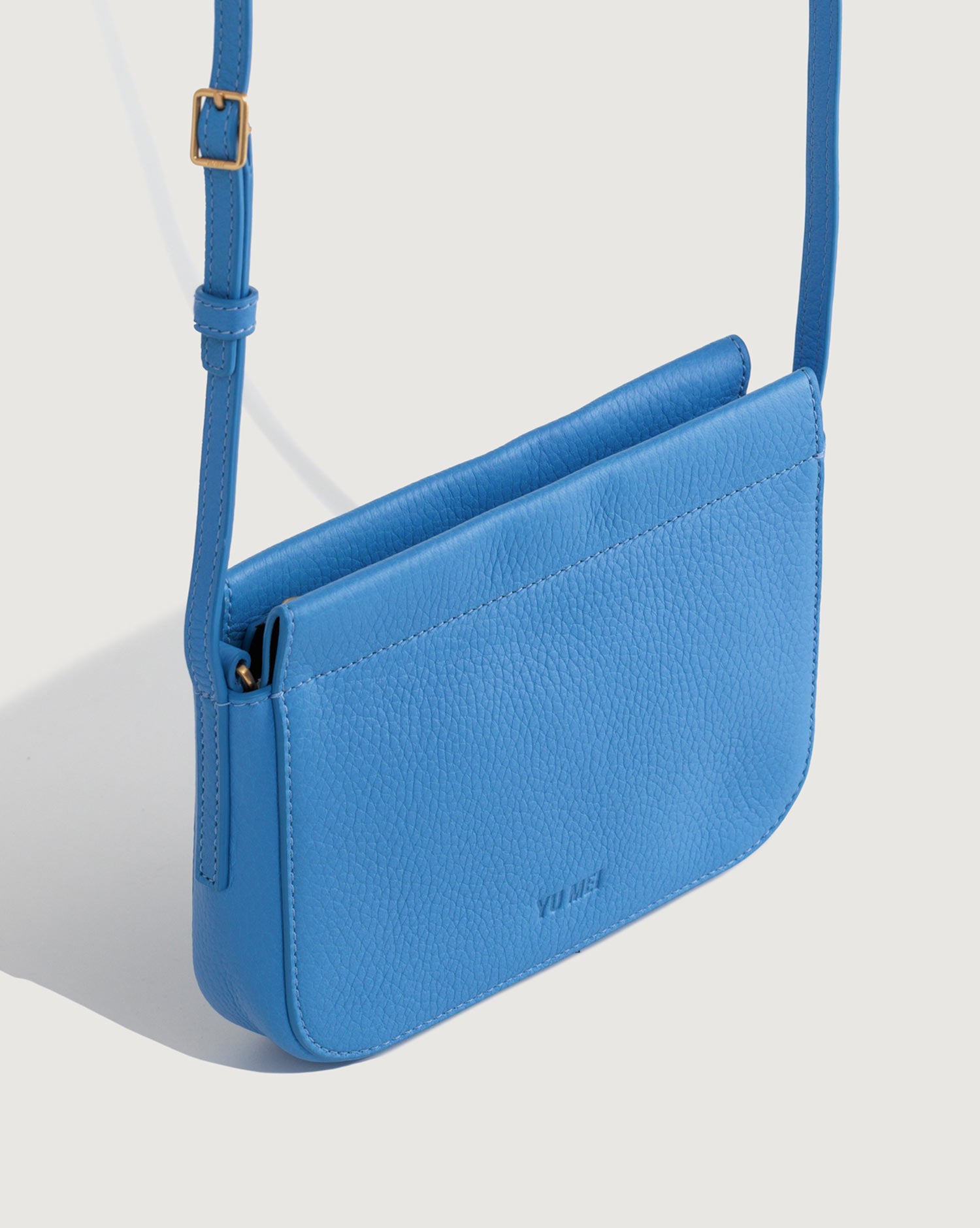 Side profile view with adjustable deer nappa strap