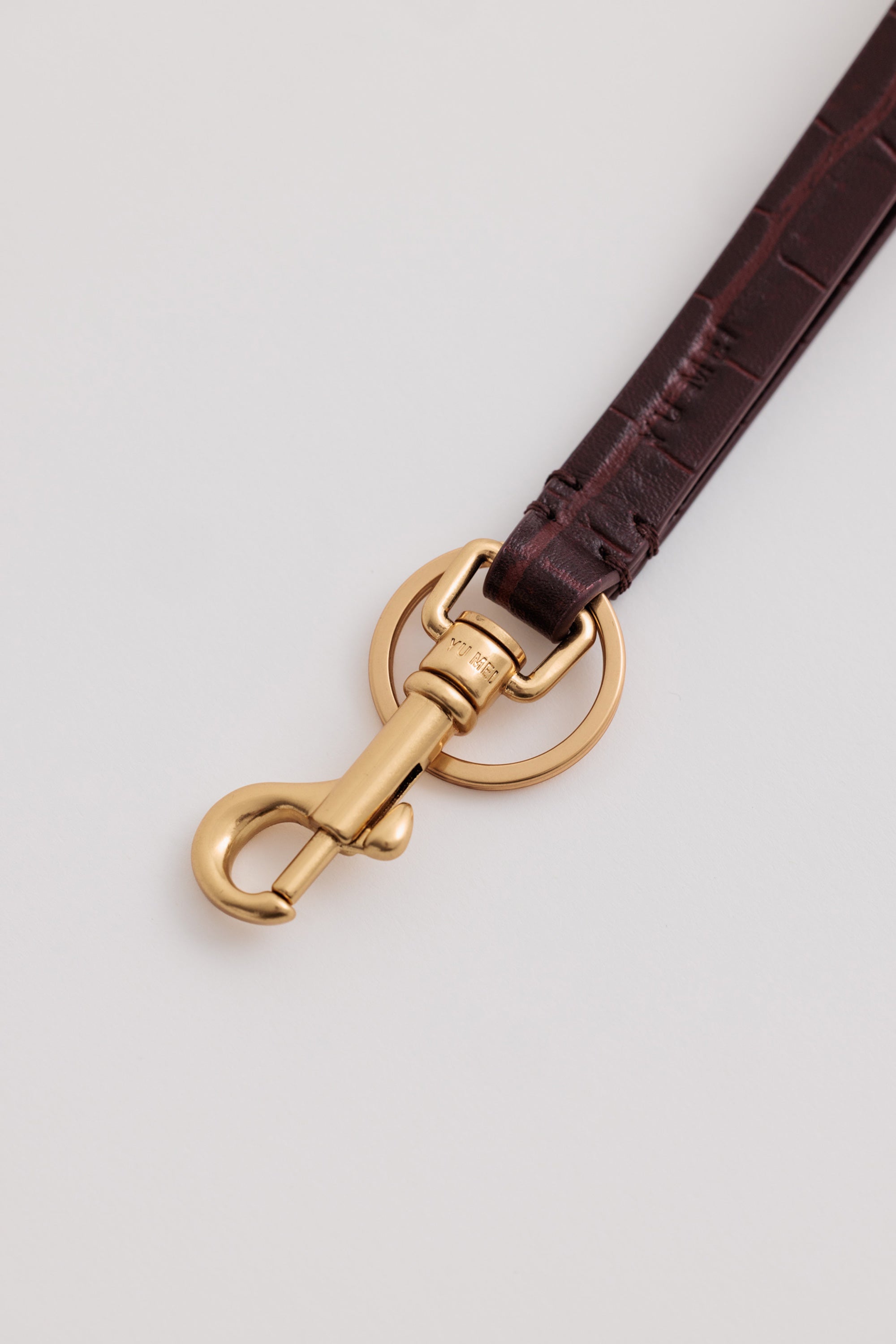 Key Fob in Fire Croc close-up showing Yu Mei branded clip