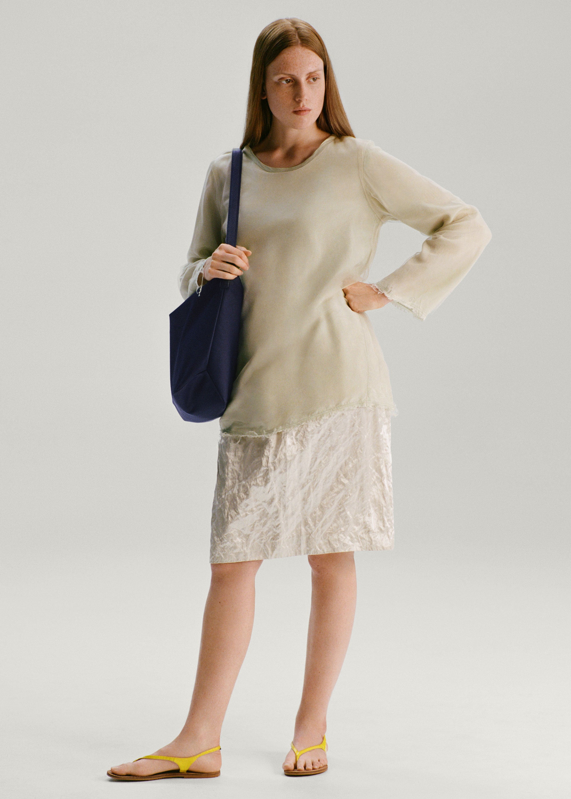 Model wearing the Medium UTILITY Braidy Bag in Double Blue nylon on shoulder wearing a white jumper