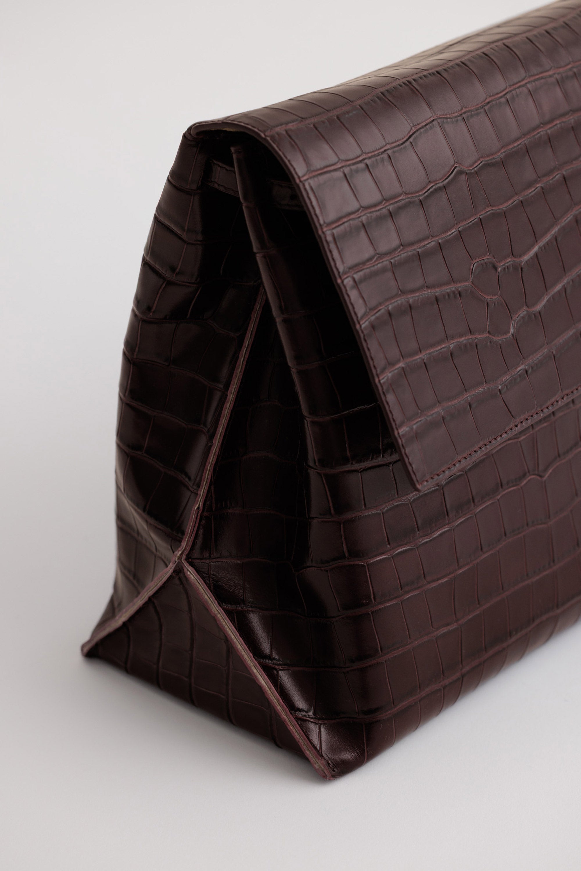 Pania Bag in Fire Croc angle view close-up showing exposed seam detailing and leather grain