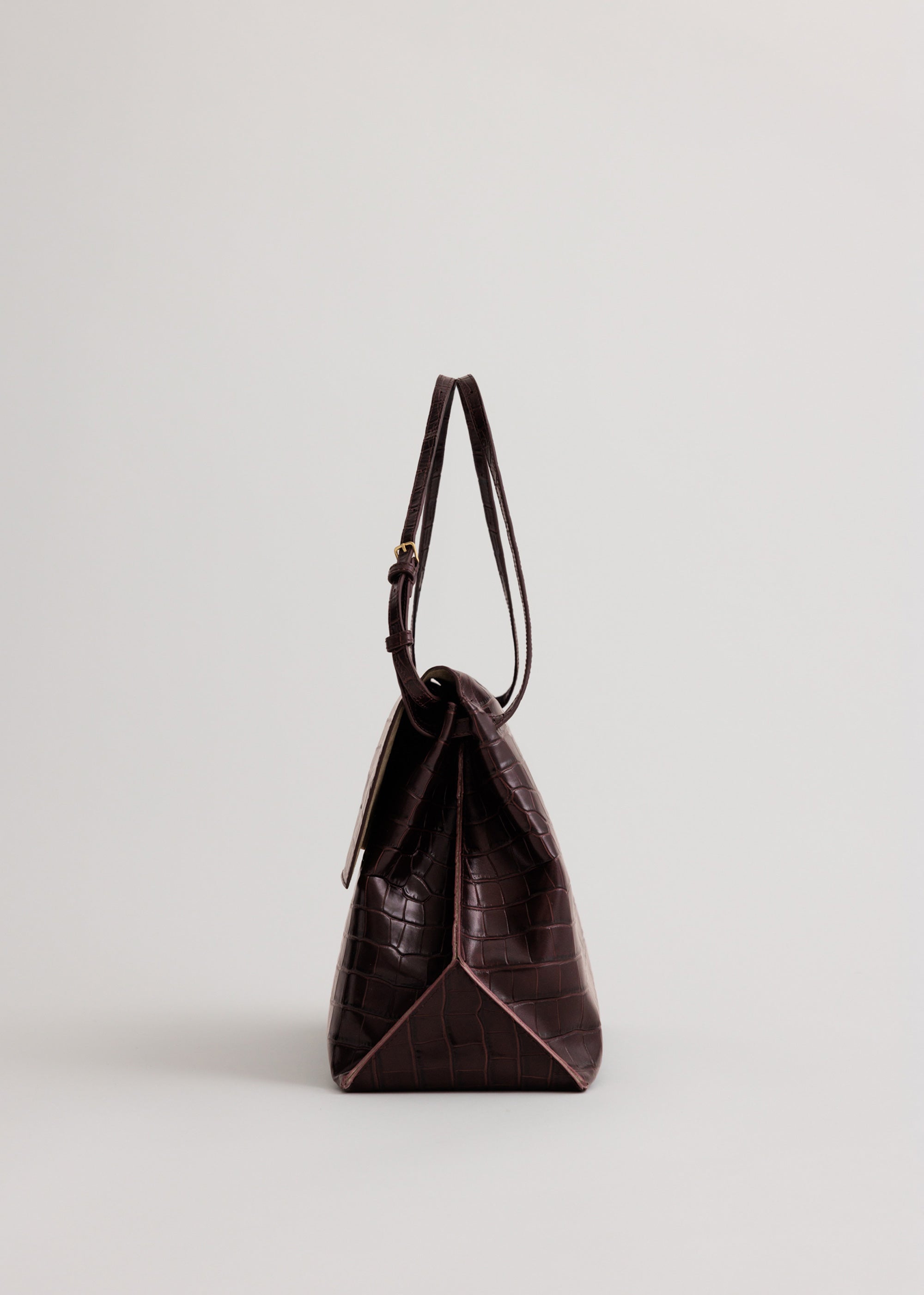 Pania Bag in Fire Croc side view showing exposed seam detailing down side