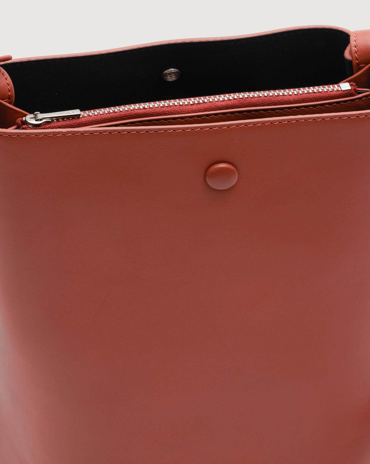 Detachable internal zipped pocket