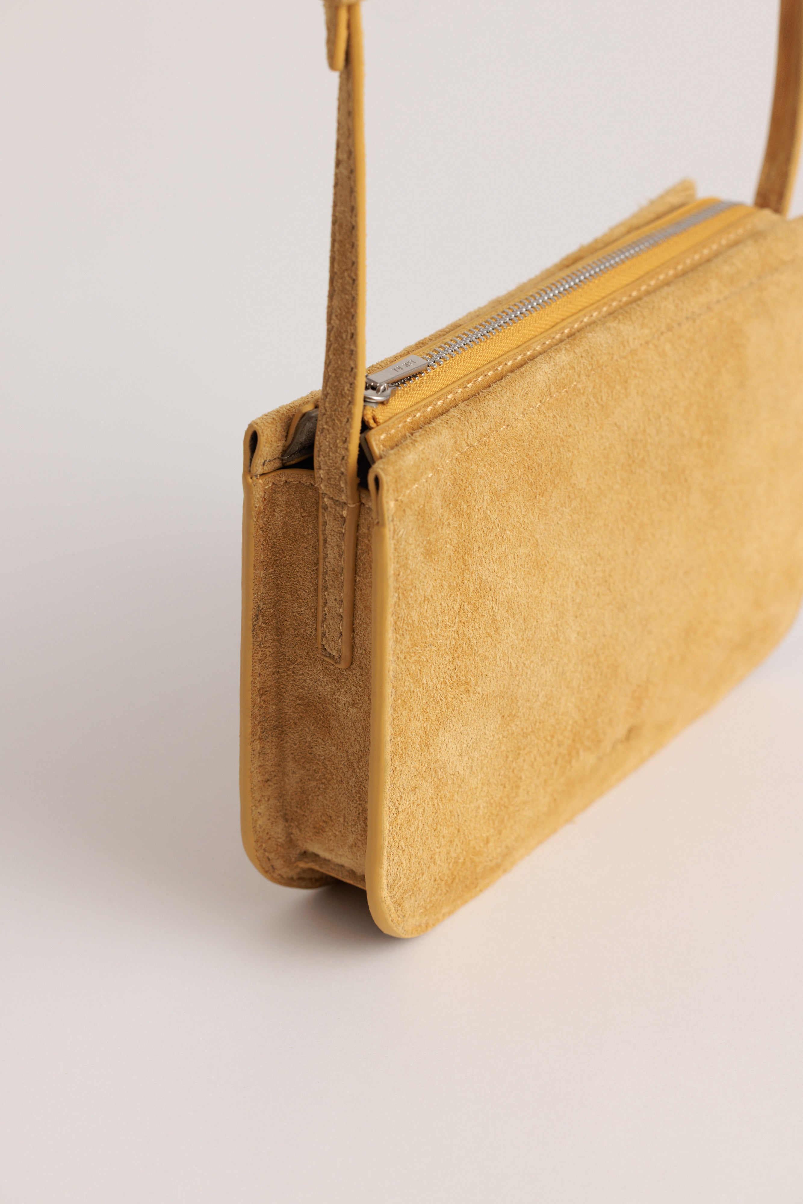Vi Bag in Sun Suede - angle strap detail view