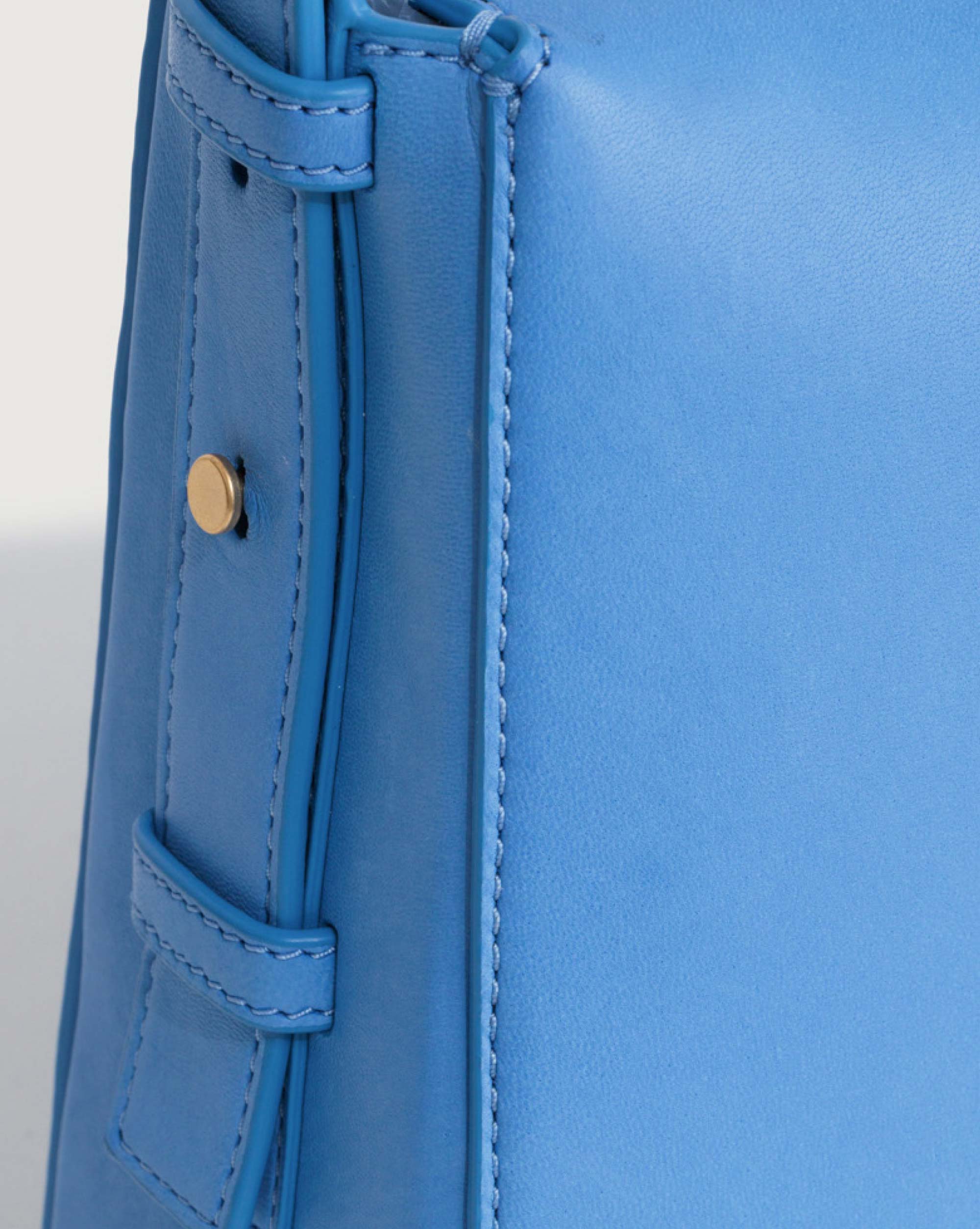 Gold metal hardware on adjustable strap